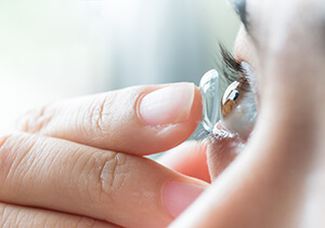 Closeup of Woman Putting in a Contact Lens